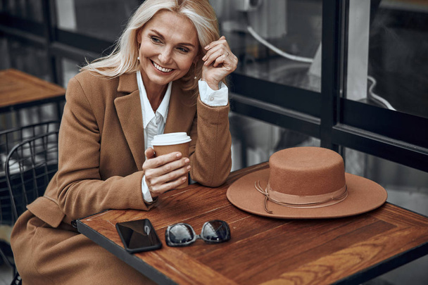 Happy woman with coffee laughing stock photo - Zdjęcie, obraz