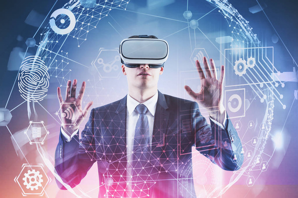 Man in VR glasses working with virtual interface - Φωτογραφία, εικόνα