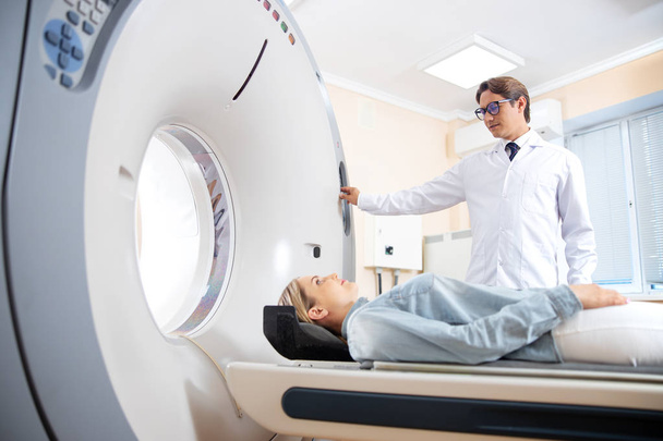 Young woman having CT scan in hospital - Фото, зображення