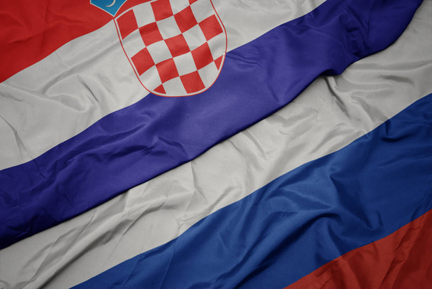 waving colorful flag of russia and national flag of croatia. - Photo, Image
