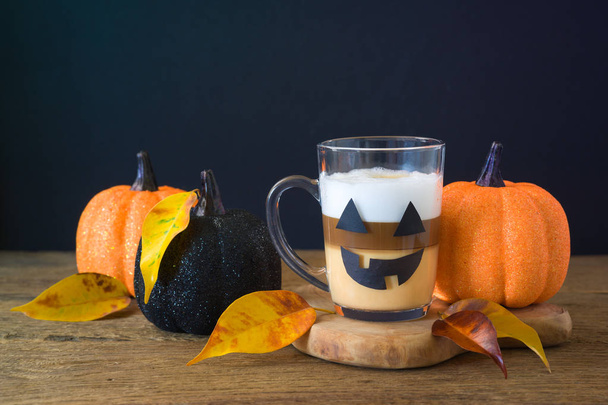 Halloween holiday concept with latte macchiato cup and glitter p - Photo, image