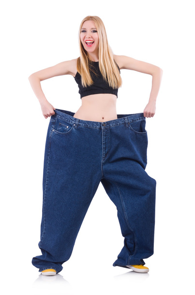 Woman in dieting concept with big jeans - Foto, imagen