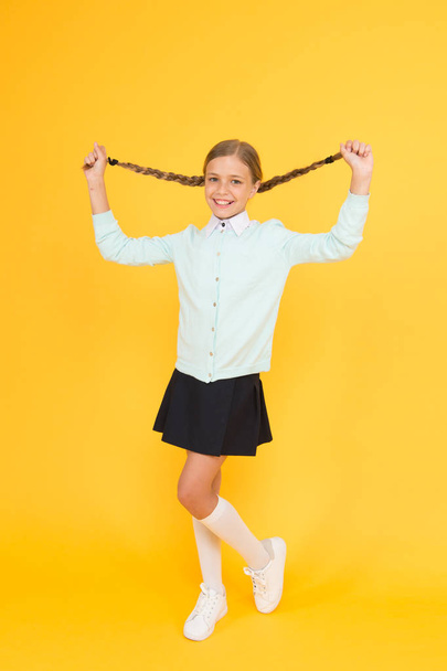 Educational activity. Homeschooling or visiting regular school. Efficiency of studying. Adorable schoolgirl. Happy schoolgirl. Schoolgirl happy smiling pupil long hair. Beginning of academic year - Photo, Image