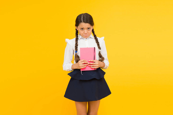 Practice and improve reading skills for school studies. Back to school concept. Girl hold book. School girl on yellow background. Study language. Study at home. Cute child study with textbook - Foto, afbeelding