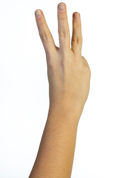 Hand in der Luft mit drei Fingern - Foto, Bild