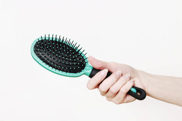 Woman holding hairbrush.  - Fotó, kép
