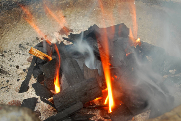 Ancient fire by using charcoal from wood. - Photo, Image