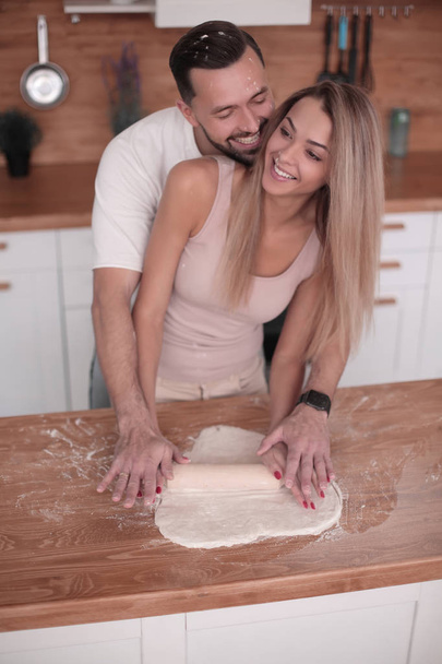 close up. young couple preparing croissants together - Photo, Image
