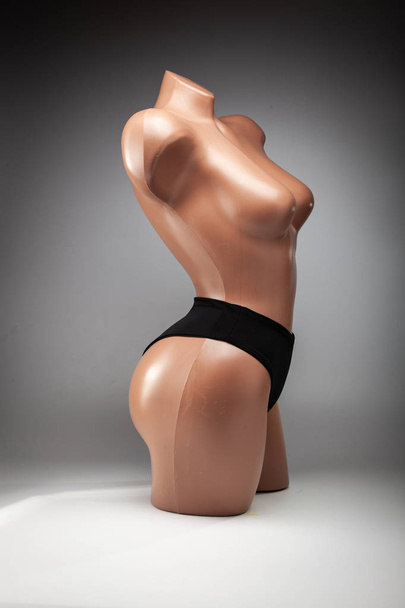 Clothes on a female mannequin, stylish marine swimsuit. - Photo, Image