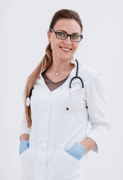 portrait of a serious woman doctor on a light background. - Фото, зображення