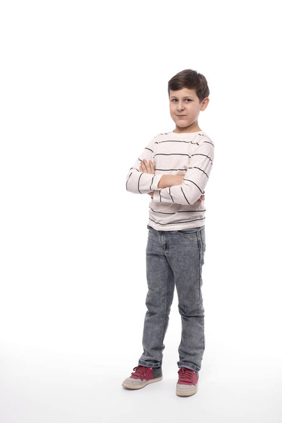 Full-length portrait of a smiling teenager boy  with arms crosse - Фото, зображення