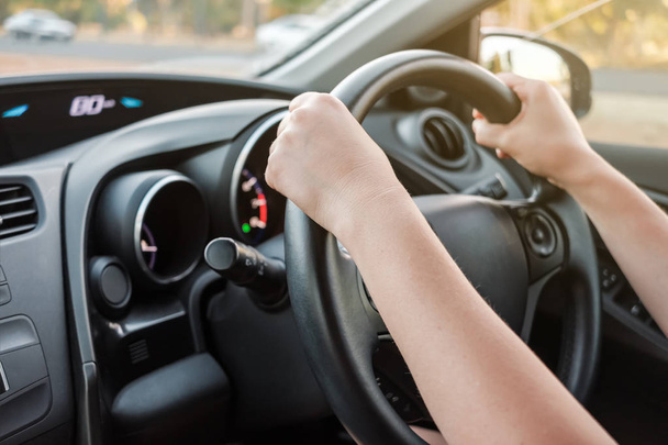 Woman's hands on car steering wheel - Photo, Image