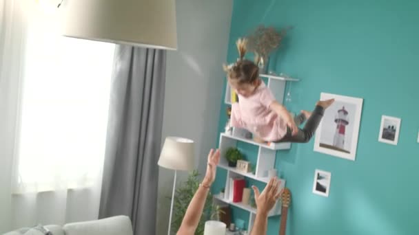 Dad throws the little daughter up high during the game - Footage, Video