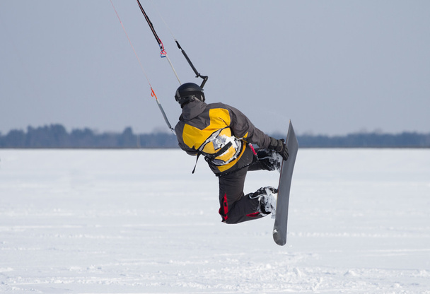 Snowkiting on a frozen lake - Photo, Image