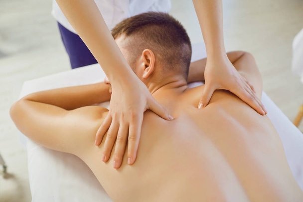 Man getting massage in the spa salon. . - Fotó, kép