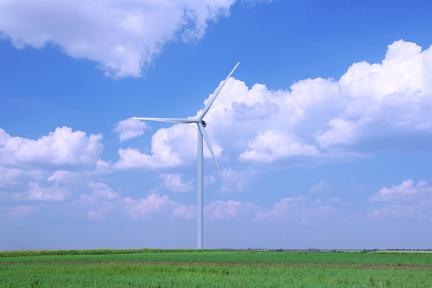 Windmill in field on blue sky background - Photo, Image