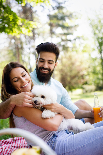 Lifestyle, happy family resting at a picnic in the park with a dog - Foto, Imagem
