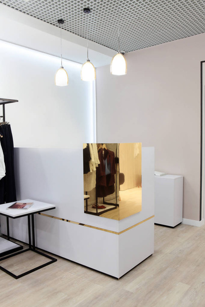 Interior of clothing store .Bright interior.Minimalistic style.Trendy colors - Photo, Image