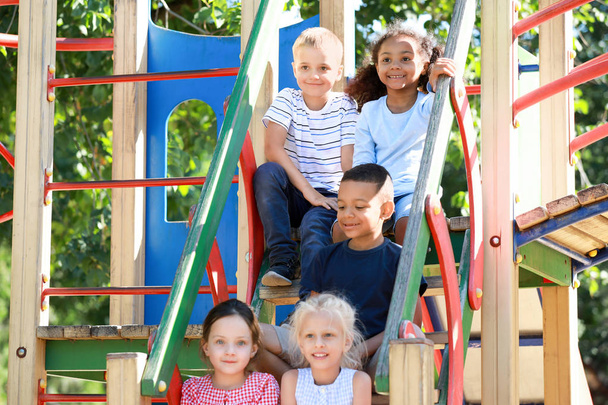 Cute little children on playground outdoors - Photo, Image