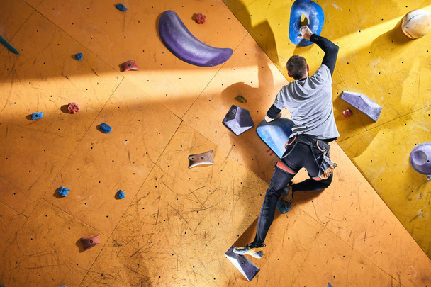 Strong active man with physical disability enjoys bouldering hobby - Fotó, kép