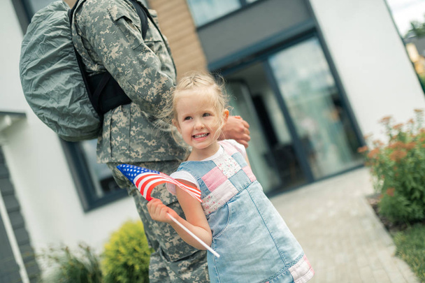 Daughter walking home with daddy returning from military service - Foto, immagini