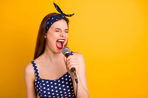 Close-up portrait of her she nice attractive lovely crazy girlish positive cheerful cheery straight-haired girl artist singing new popular melody isolated on bright vivid shine yellow background - Foto, Imagem