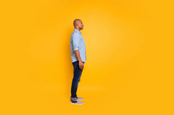 Full body profile side photo of concentrated millennial listen look isolated over yellow background - Valokuva, kuva