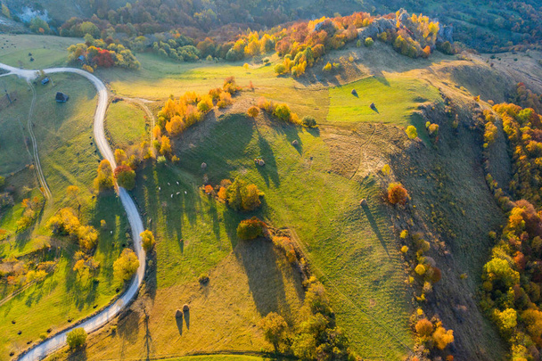 Idyllic aerial drone shot of autumn countryside hills - Fotó, kép