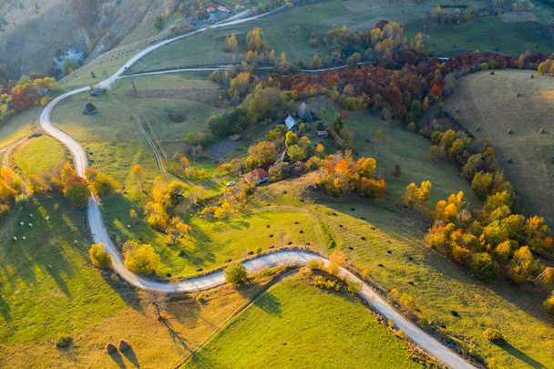 Idyllic aerial drone shot of autumn countryside hills - Photo, image