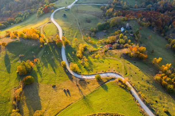 Idyllic aerial drone shot of autumn countryside hills - Zdjęcie, obraz
