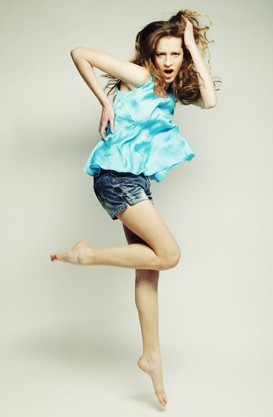 High fashion model jumps in studio - Foto, Bild
