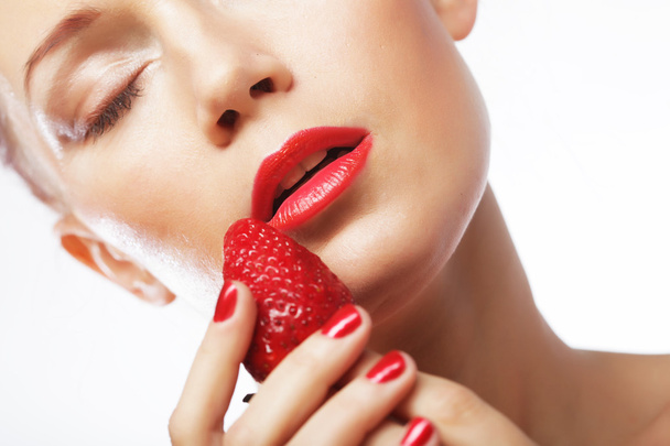 Beautiful happy smiling woman with strawberry - 写真・画像