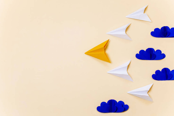 Leadership concept with origami paper planes and 3d clouds. Creative concept for banner/landing page/background. - Foto, Imagen