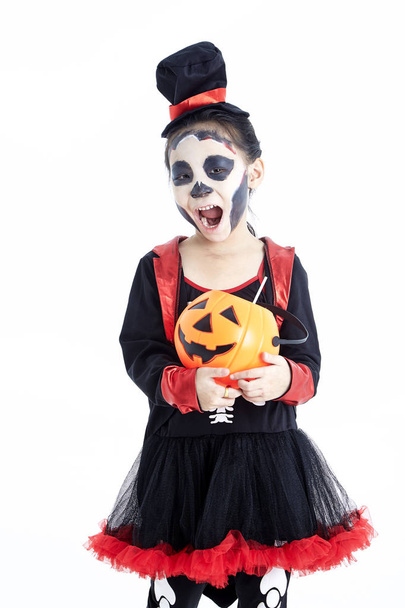 little girl holding jack o lantern pumpkin basket - Fotó, kép