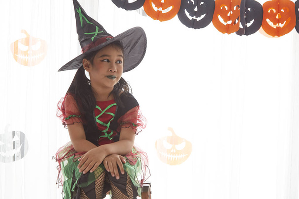 Happy child girl in witch costume to halloween - Photo, Image