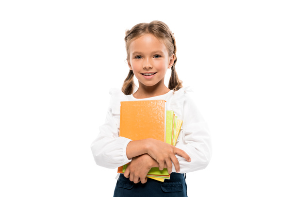 heureux écolier tenant des livres isolés sur blanc
  - Photo, image