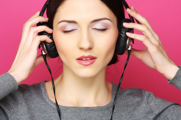 Beautiful woman with headphones - Fotó, kép