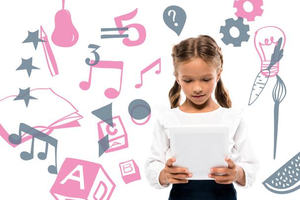 leuke school jongen met behulp van digitale Tablet in de buurt van fruit en muziek notities op wit  - Foto, afbeelding