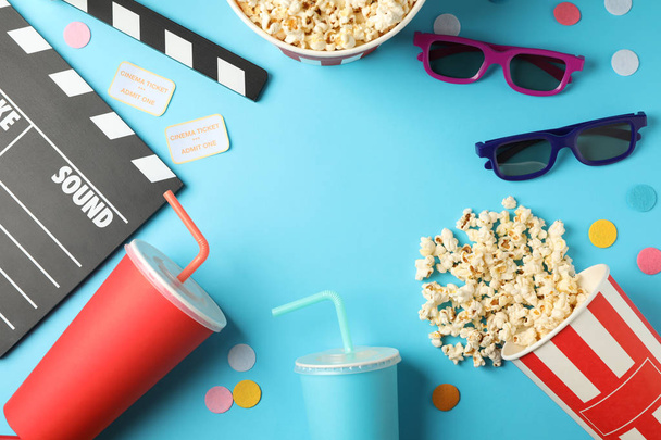 Flat lay composition with drinks, popcorn, 3d glasses, clapperbo - Photo, Image