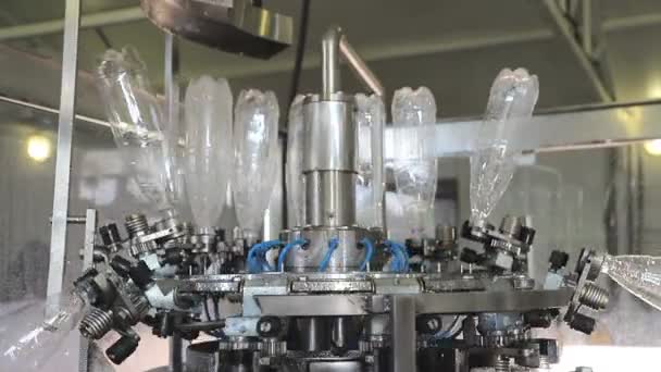 Automatic Water bottling line in plastic white bottles. Plastic bottles are sent to the line. - Footage, Video