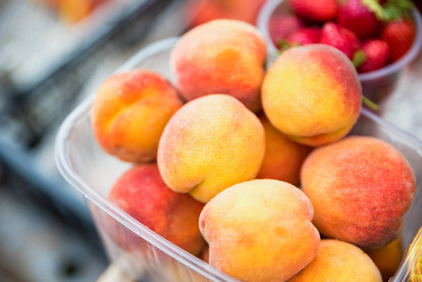 Ripe organic peaches for sale in market - Photo, Image