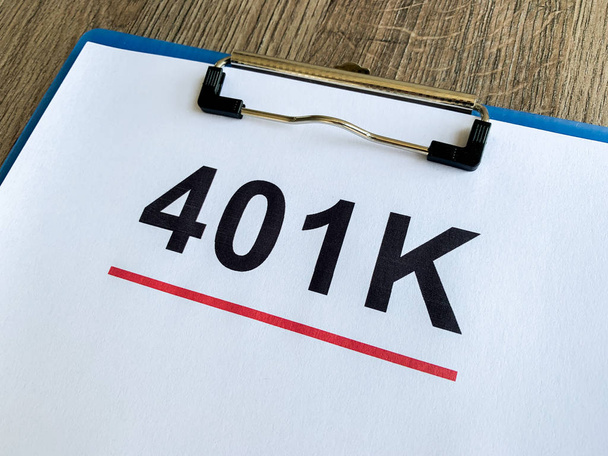 Paper with 401k plan on wood table. - Photo, Image