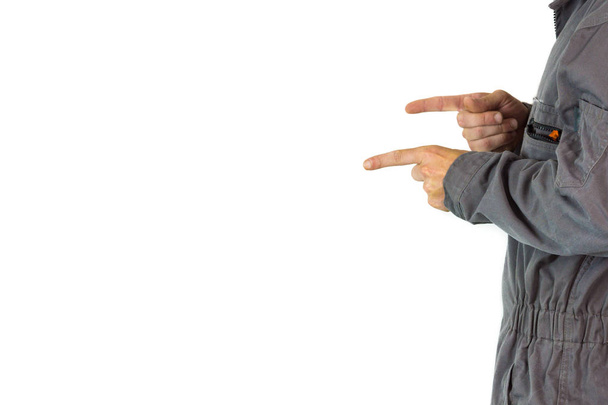 man with work overall pointing at White background, isolated on white - Foto, Bild