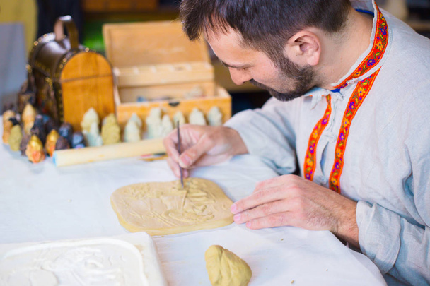 Potter making clay stamp picture - Fotografie, Obrázek