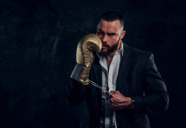 Portrait of handsome bearded man in boxing gloves - Foto, Imagem