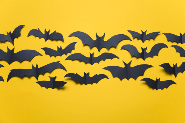 Halloween paper vampire bat decorations on an orange background. - Zdjęcie, obraz