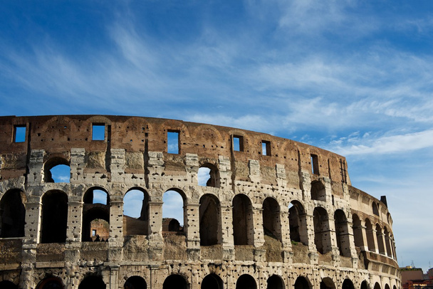 Colosseum in Rome, Italy on cloudy sky background. The Colosseum. Famous place. Cloudy blue nice sky background. - Photo, Image