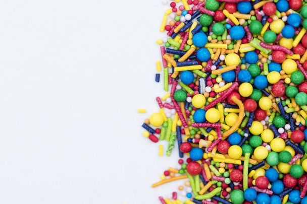 Colourful candy cake decorative sprinkles background - Photo, image