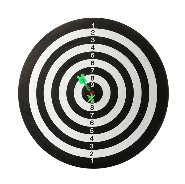 Green arrows hitting target on dart board against white background - Foto, afbeelding