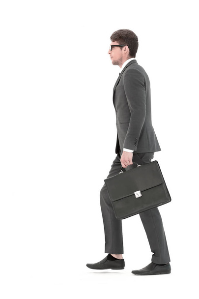 side view. a businessman with a leather briefcase comes forward. - Fotografie, Obrázek
